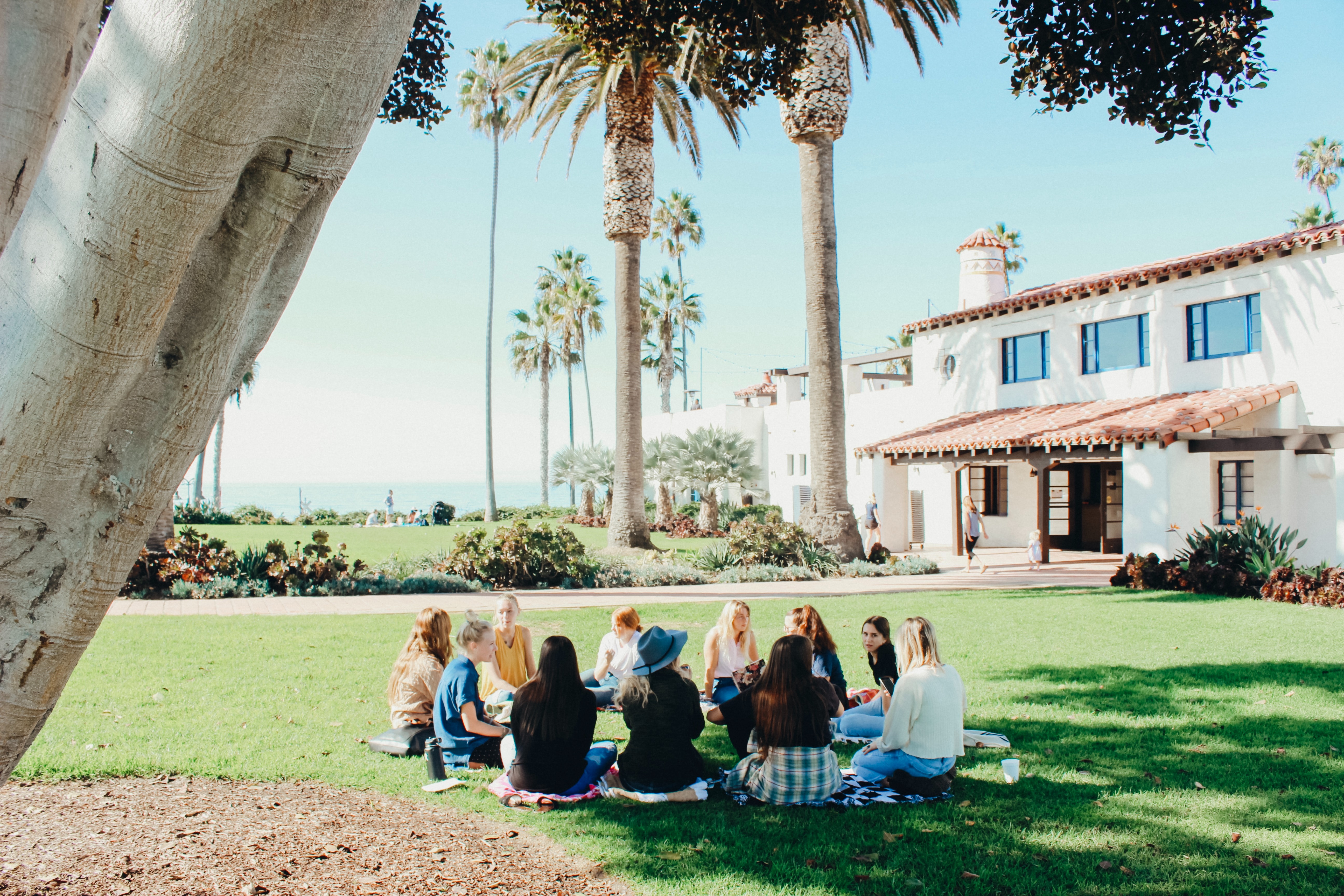 Group of girls meeting up by the coast