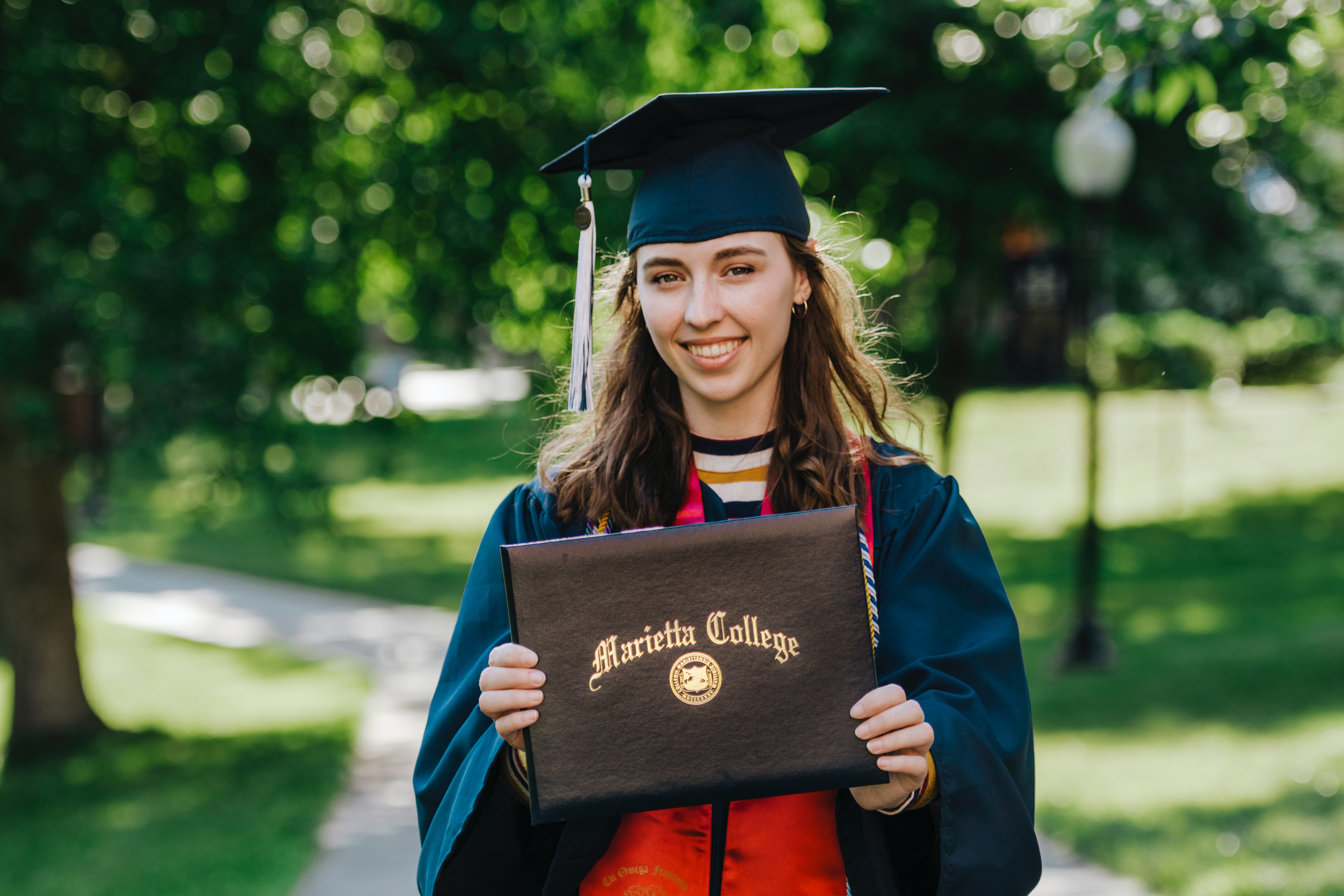 Girl graduates college and shows off degree