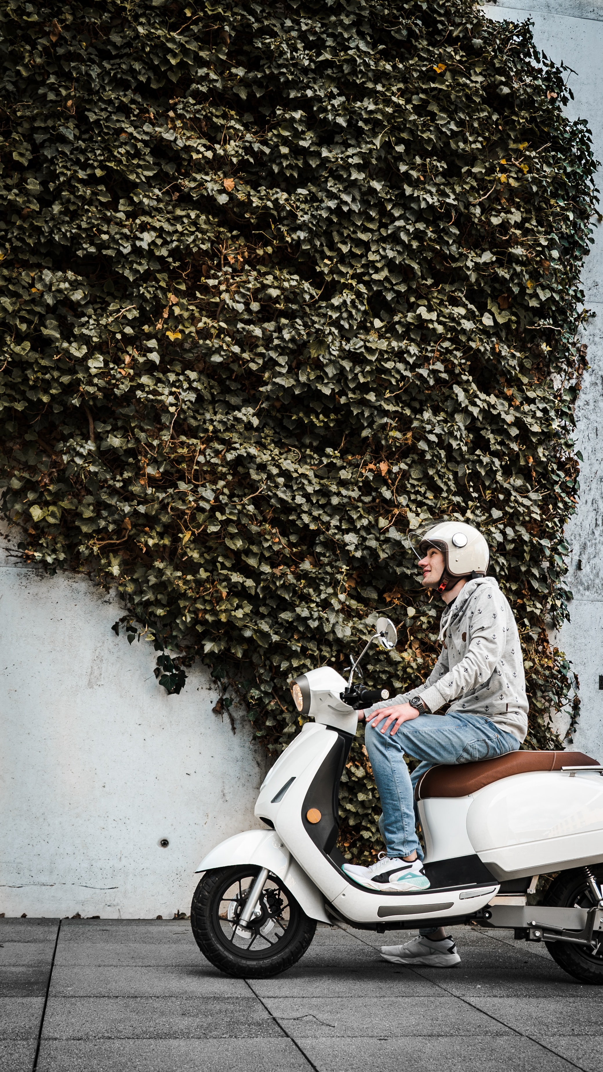 Guy on moped driving through the city