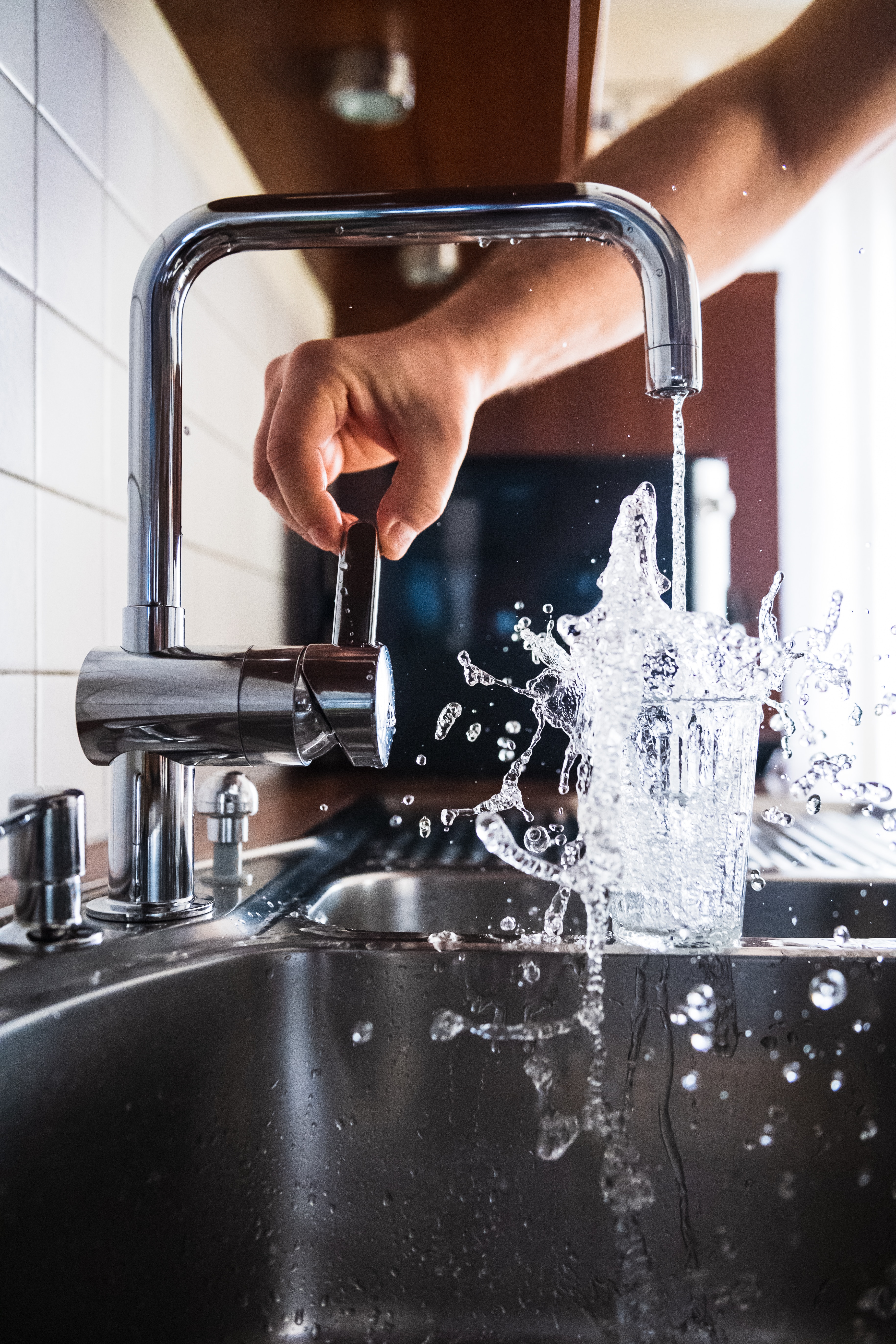 Filling up a glass of water from the tap